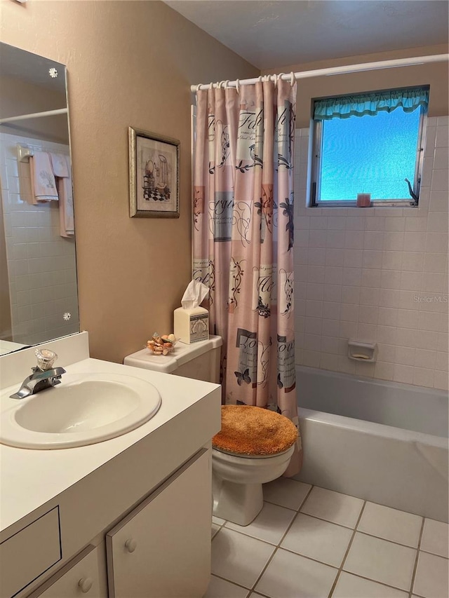 full bathroom featuring vanity, tile patterned floors, toilet, and shower / bath combo