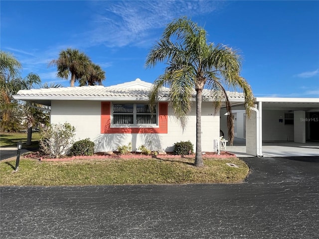 ranch-style home with a carport