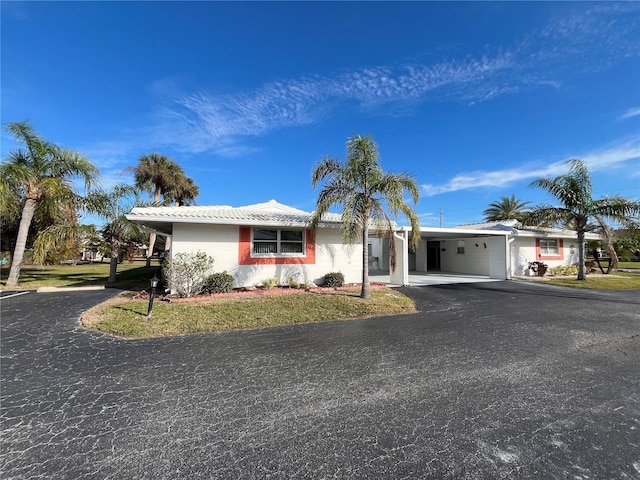 single story home with a carport and a front yard