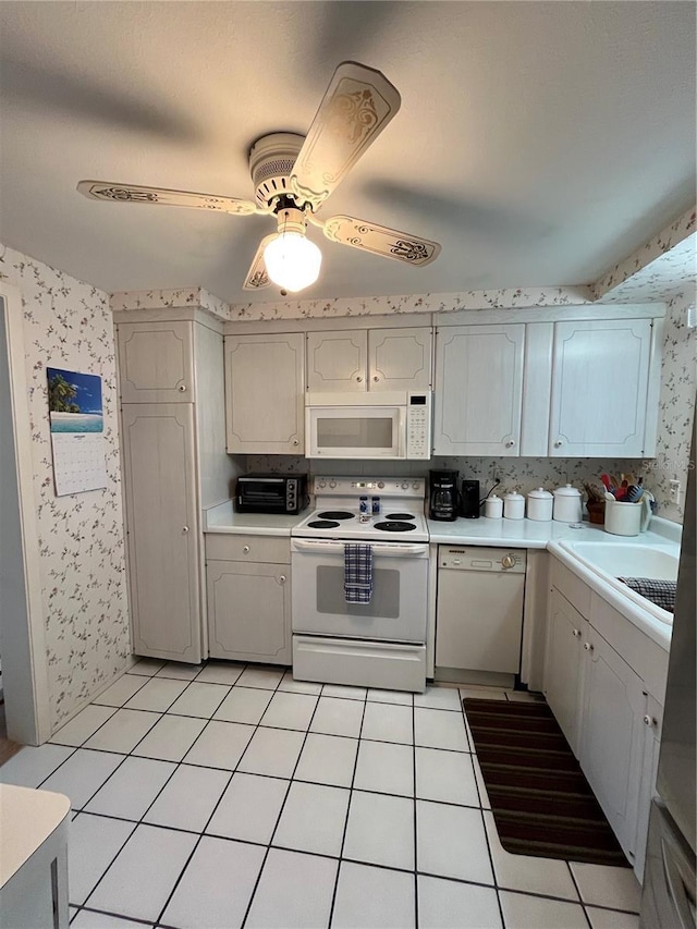 kitchen featuring white appliances, ceiling fan, and light tile patterned flooring