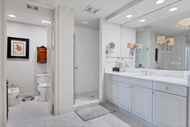 bathroom featuring a shower, vanity, toilet, and a bidet