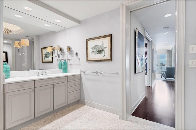 bathroom with wood-type flooring and vanity