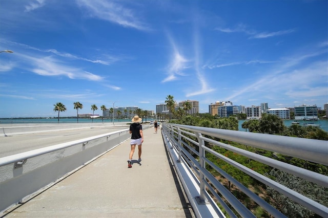 exterior space featuring a beach view and a water view