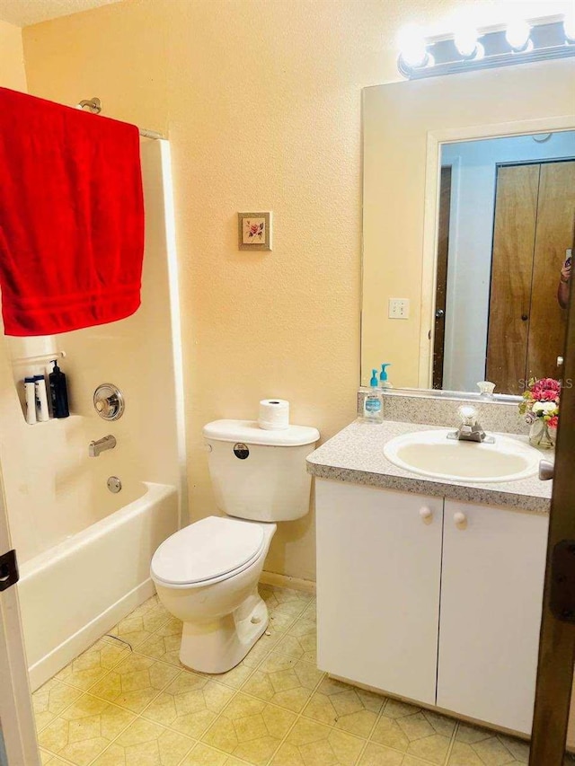 full bathroom featuring shower / washtub combination, vanity, and toilet