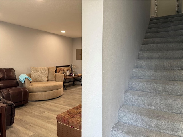 stairs featuring wood-type flooring