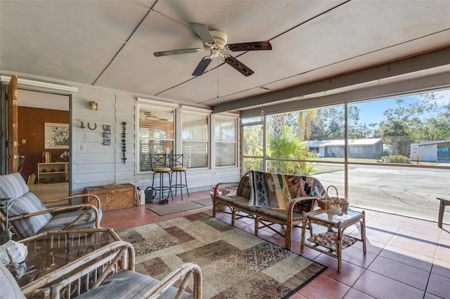 sunroom / solarium with ceiling fan