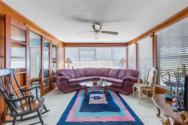 sunroom / solarium featuring ceiling fan