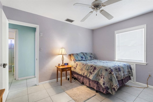 bedroom with light tile patterned floors and ceiling fan