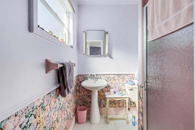 bathroom featuring a shower with door and tile patterned flooring