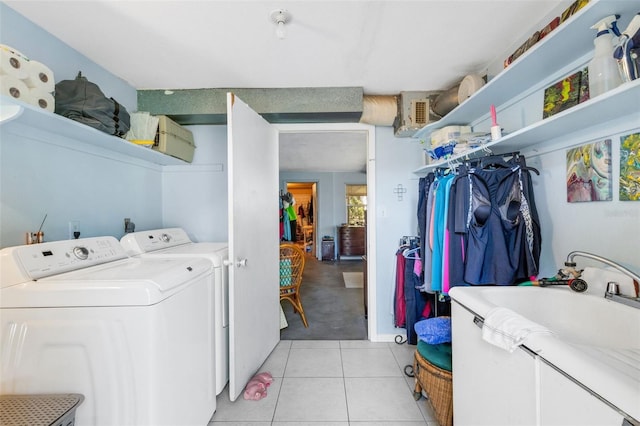 laundry room with separate washer and dryer and light tile patterned floors