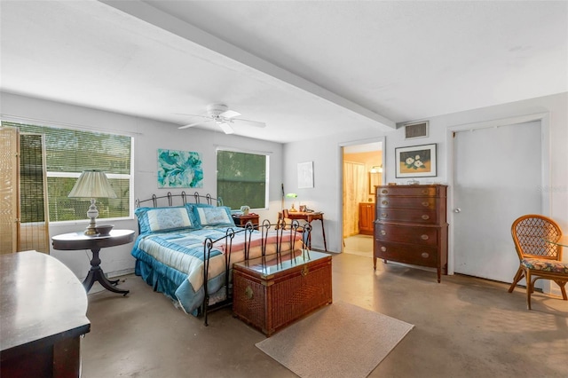 bedroom featuring ceiling fan, connected bathroom, beam ceiling, and concrete flooring