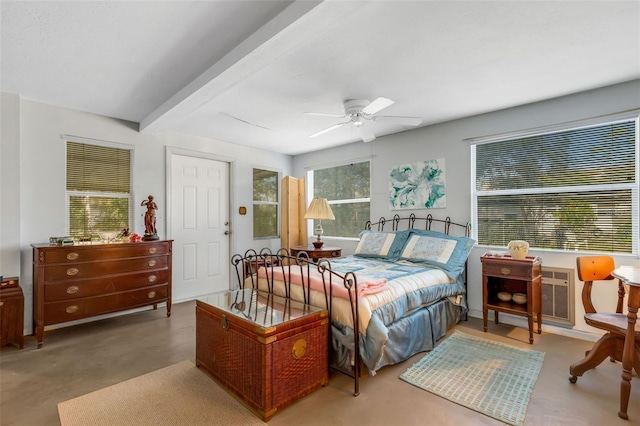 bedroom featuring ceiling fan, concrete floors, and beamed ceiling