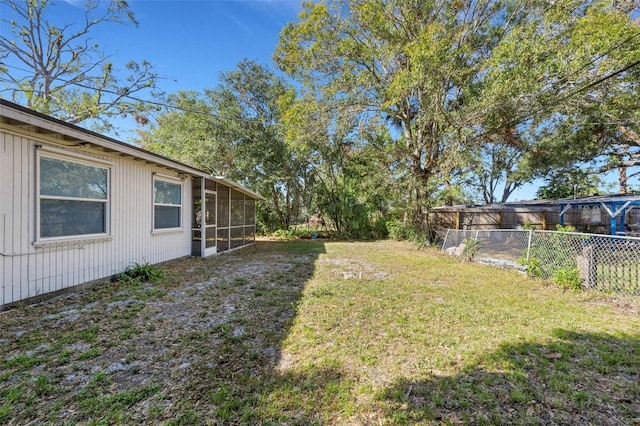 view of yard featuring a sunroom