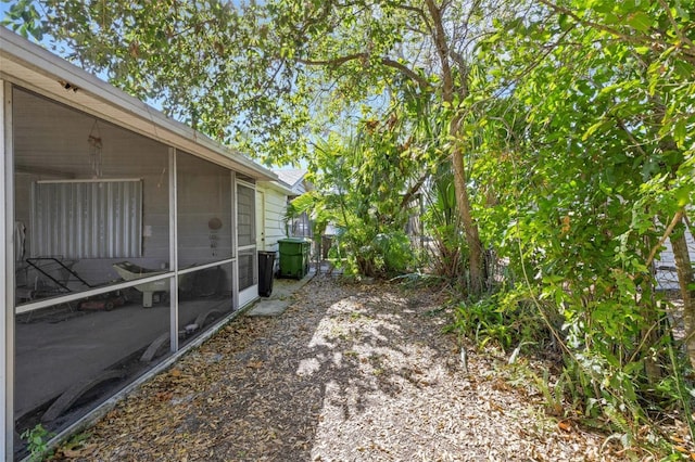 view of side of property featuring a sunroom