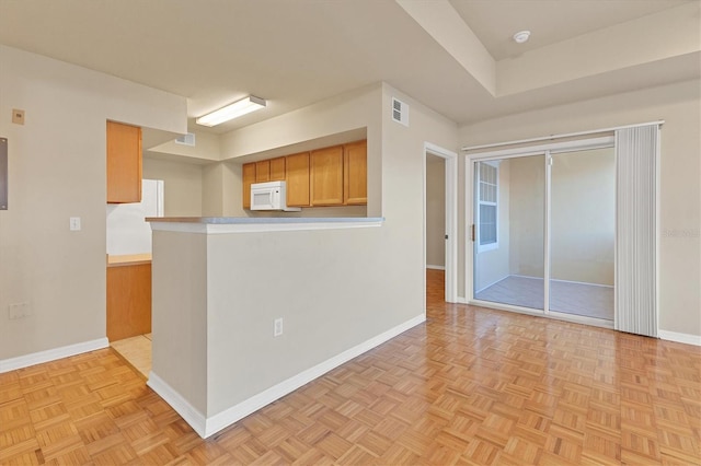 kitchen with light parquet floors