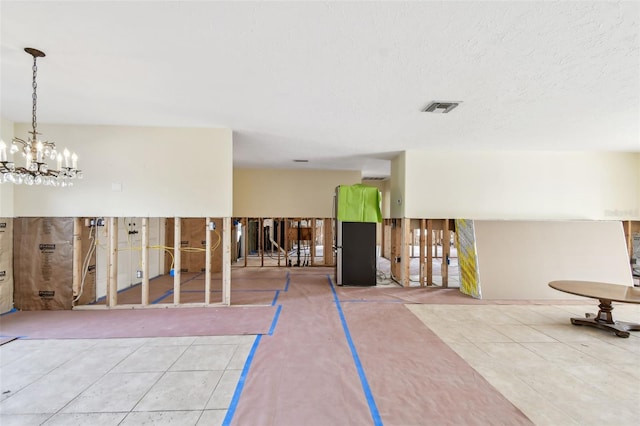 interior space featuring tile patterned floors and an inviting chandelier