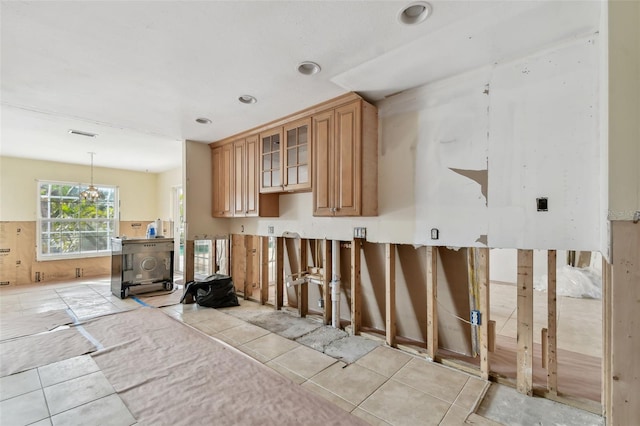 kitchen featuring light tile patterned floors and hanging light fixtures