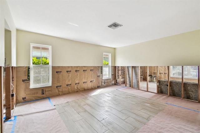 unfurnished living room with a healthy amount of sunlight