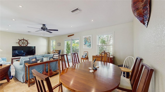 dining room featuring ceiling fan