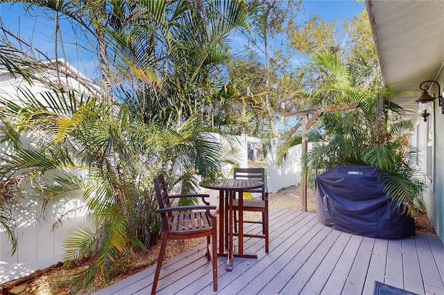 wooden deck featuring grilling area