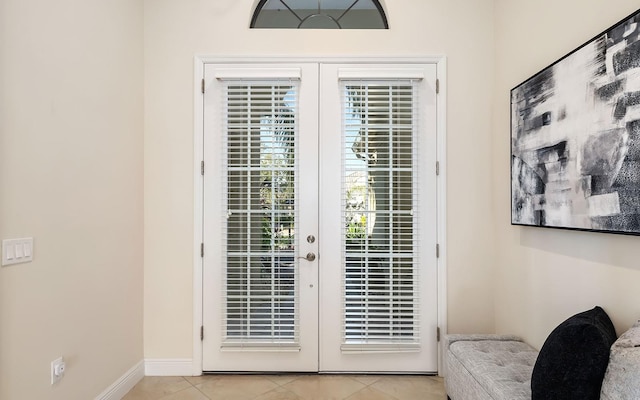 doorway to outside with french doors and light tile patterned floors