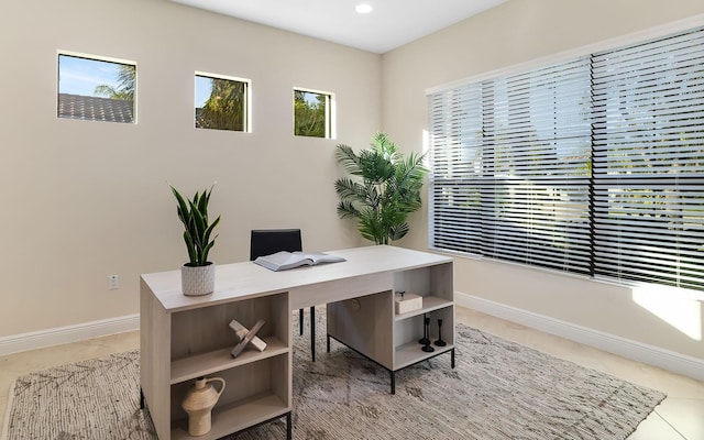 office space with tile patterned flooring and a wealth of natural light