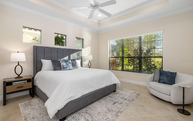 bedroom featuring a raised ceiling, ceiling fan, light tile patterned floors, and ornamental molding