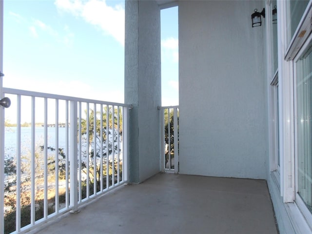 balcony featuring a water view