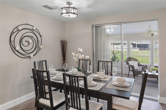 dining area featuring hardwood / wood-style floors and ceiling fan