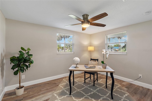 home office with hardwood / wood-style flooring, plenty of natural light, and ceiling fan