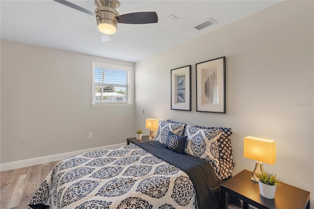 bedroom featuring hardwood / wood-style floors and ceiling fan