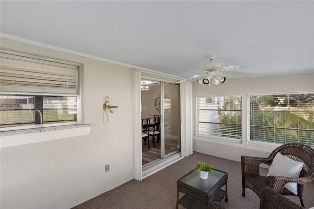 sunroom / solarium with ceiling fan