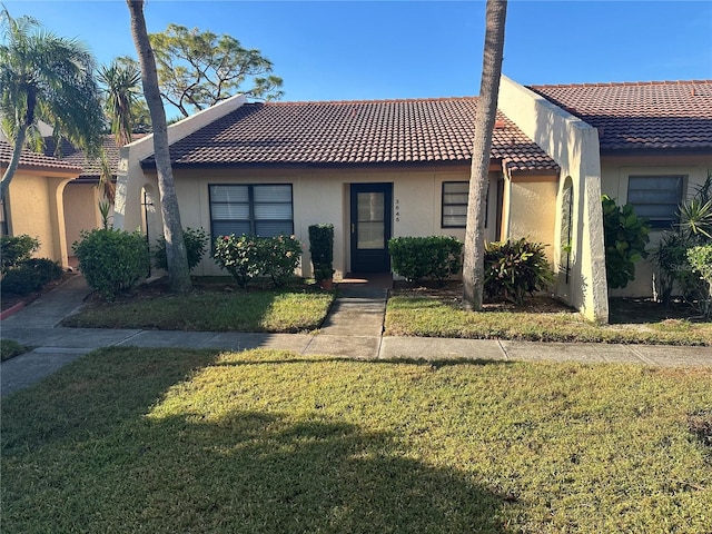 view of front of property with a front lawn