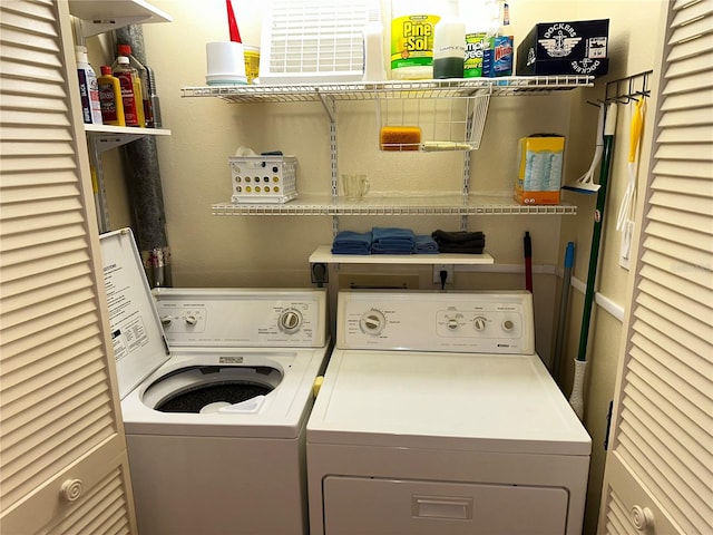 clothes washing area with washing machine and clothes dryer