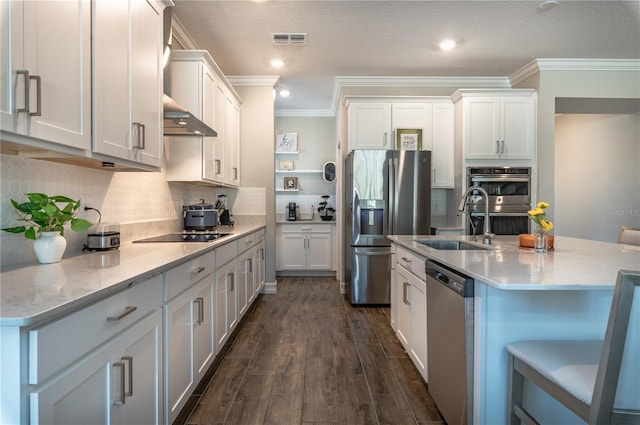 kitchen featuring white cabinetry, sink, stainless steel appliances, dark hardwood / wood-style floors, and ornamental molding