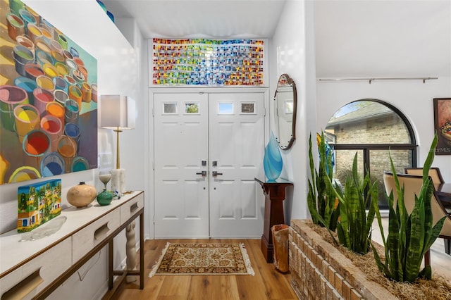 entryway with light hardwood / wood-style flooring