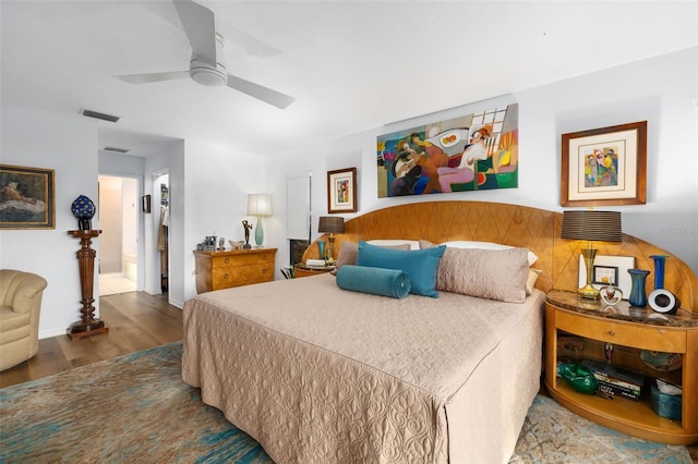 bedroom with wood-type flooring and ceiling fan