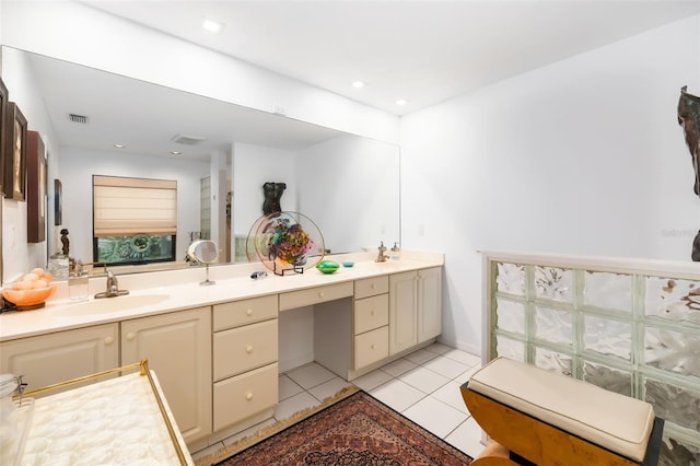 bathroom featuring tile patterned flooring and vanity