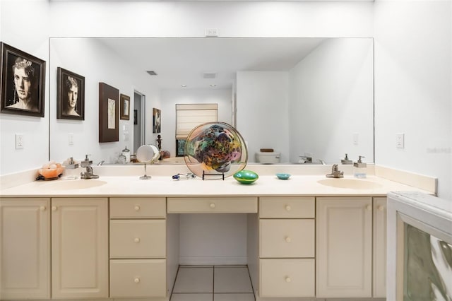 bathroom featuring tile patterned flooring, vanity, and toilet