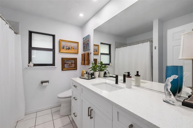 bathroom with tile patterned floors, vanity, and toilet