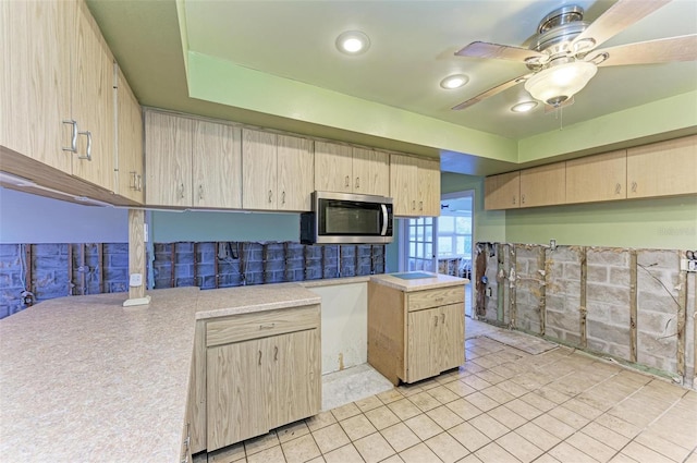 kitchen with ceiling fan, light brown cabinets, and light tile patterned floors