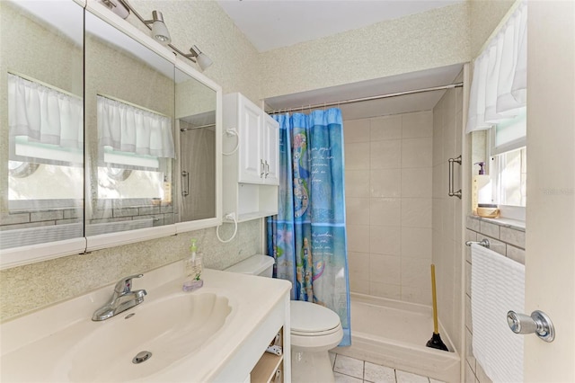 bathroom featuring tile patterned floors, vanity, curtained shower, and toilet