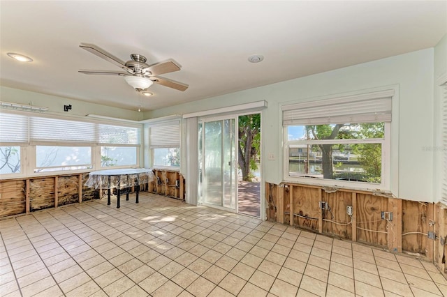 sunroom featuring plenty of natural light and ceiling fan