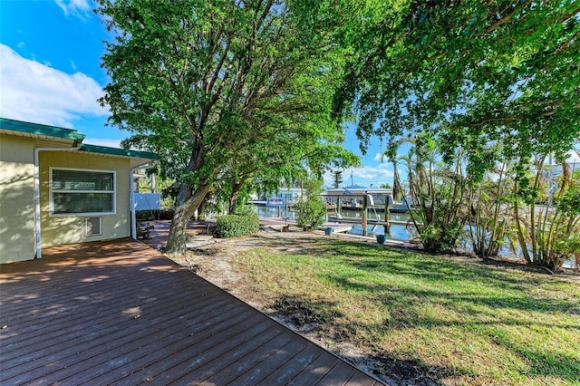 wooden deck with a lawn