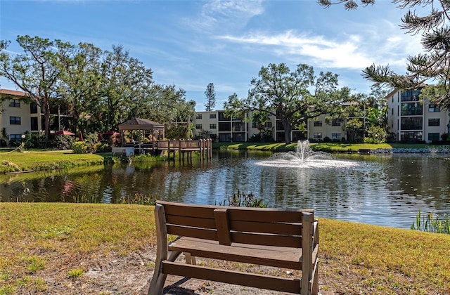 view of community with a gazebo and a water view