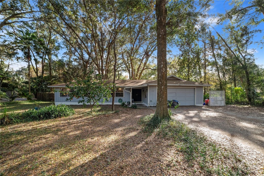 single story home featuring a garage