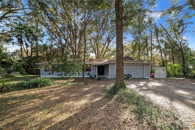 single story home featuring a garage