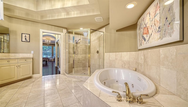 bathroom featuring tile patterned flooring, vanity, and independent shower and bath