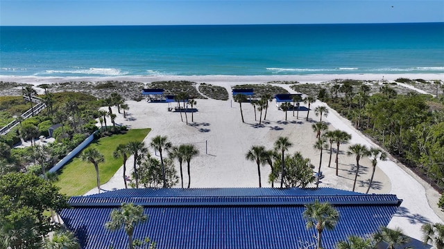 aerial view with a water view and a beach view