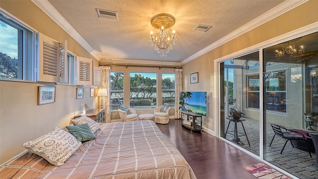 bedroom featuring access to outside, hardwood / wood-style floors, a notable chandelier, and ornamental molding